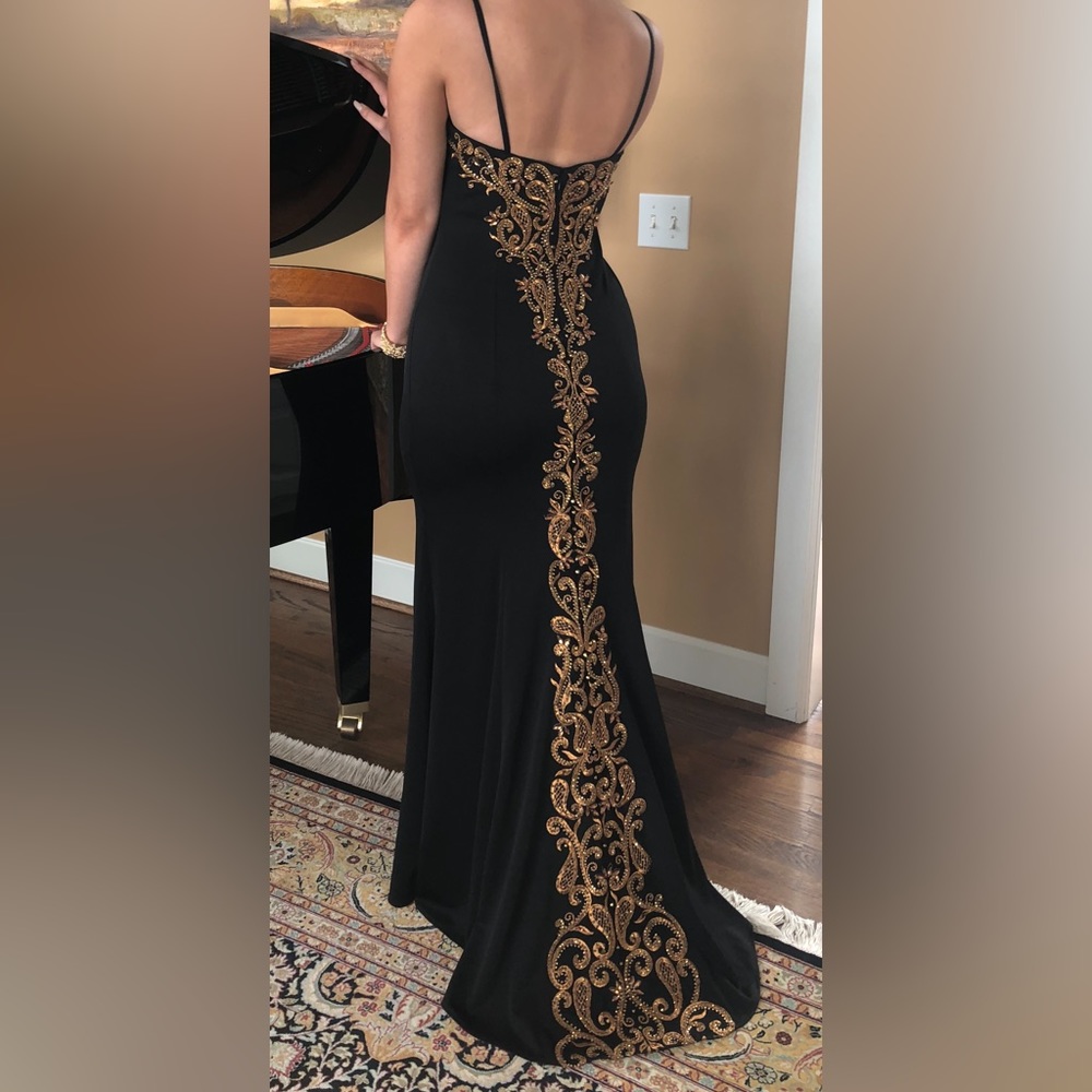 Stunning black with gold embroidering formal gown. Perfect condition worn once!
